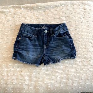Justice dark blue jean shorts. Girls size 8